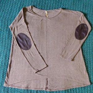 Boutique tunic top with elbow patch detail.